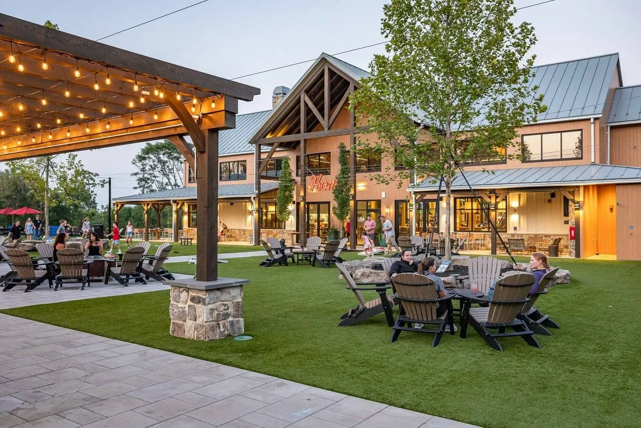 Lark Brewing Co taproom and outdoor lawn at sunset, Aldie Virginia design-build project
